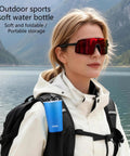 Person outdoors with backpack featuring Foldable Water Bottle 200ml Shatterproof, Lightweight Hydration Bottle For Running, Travel And Adventure.