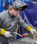 Man wearing Cowhide Welding Gloves SafeGear For Tig Welding Wing Thumb EN388 3131 Certified Medium 2 Pack at workbench