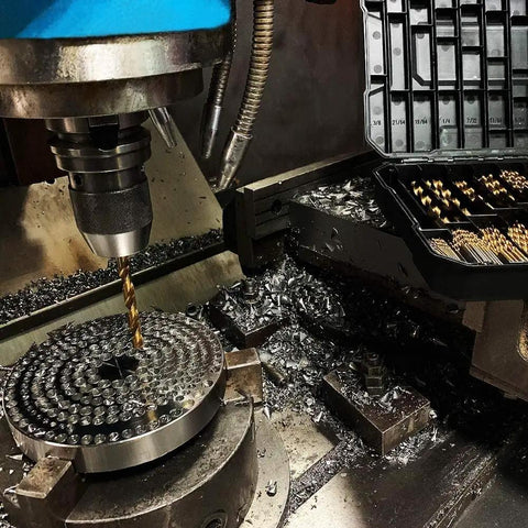 Heavy Duty 99 Piece Drill Bit Set For Steel Wood And Aluminum Alloy With Sturdy Carry Case in a workshop with metal shavings.