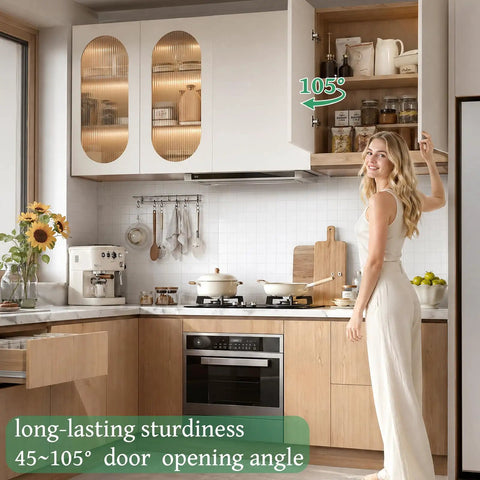 Woman demonstrating Soft Close Concealed Cabinet Hinges Half Inch Overlay, 30 Pack 15 Pairs in modern kitchen with open cabinet door.