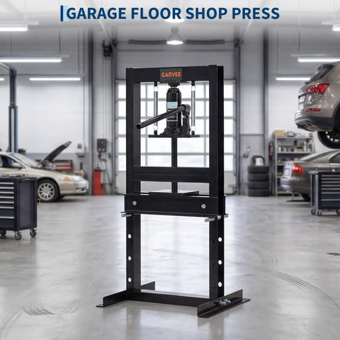 Tough As Nails Six Ton H Frame Hydraulic Shop Press Heavy Duty Steel Workhorse in garage with adjustable base for metal work.