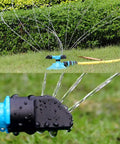 Automatic Lawn Sprinkler For Large Yards, ABS Plastic Rotary Sprinkler With Three Arm Design in operation on grass