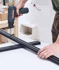 Person assembling Four 39.4 Inch T Slot 2040 Aluminum Extrusion Profiles With Anodized Linear Rails European Standard Heavy Duty DIY Kit