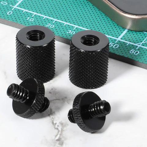 Built Tough Aluminum 4 Pack 1/4 To 1/4 Inch Threaded Tripod Screw Adapters With Double Male Female Ends on a work surface.