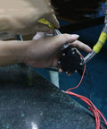 Hands installing Ultra Compact 10W Hydroelectric Generator Water Powered 12V DC Brushless Turbine With Voltage Stabilizer For DIY Projects