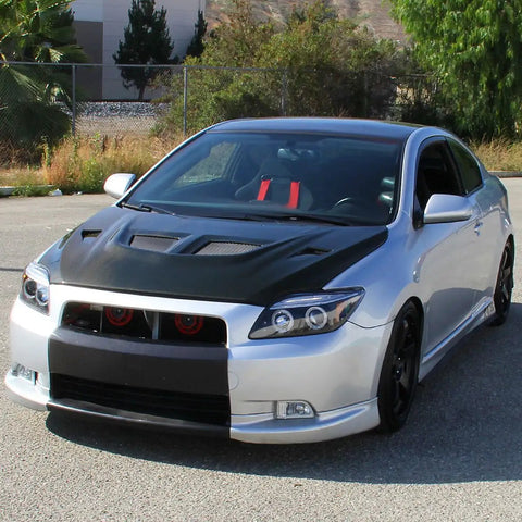 2005 To 2010 Scion tC with LED Halo Projector Headlights Upgrade Kit and black housing, parked outdoors