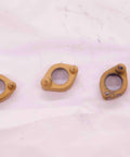 Four Piece Insert Clamp Set For Indexable Tooling And Hardware Spare Parts Top Shelf Replacement Clamps, gold-colored parts.
