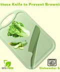 11 Inch Plastic Lettuce Knife With Serrated Blade To Keep Greens Kickin Fresh And Block Browning on a cutting board with vegetables.