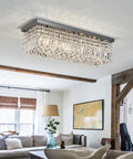 Showstopping Five Light K9 Crystal Chandelier Pendant Ceiling Light with island design in a modern living room setting.
