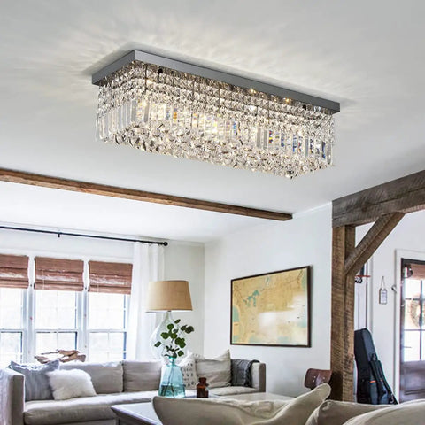 Showstopping Five Light K9 Crystal Chandelier Pendant Ceiling Light with island design in a modern living room setting.