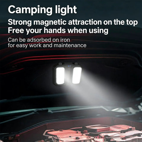 Portable Telescopic Camping Light with adjustable stand and built-in power supply illuminating a car engine.