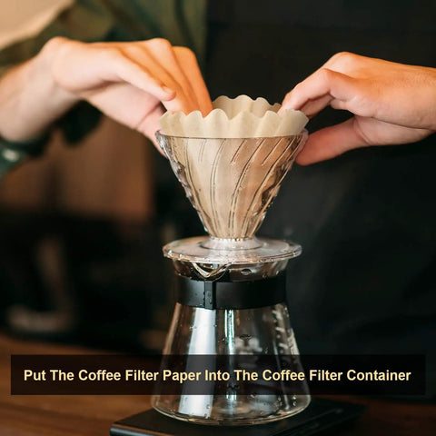 Person placing a natural brown unbleached coffee filter into a pour-over brewer, Bulk 100 Count One To Four Cup Disposable Coffee Filters Natural Brown Unbleached Basket Style For Home And Office Use Great For Pour Over And Drip Coffee Makers