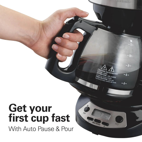 Hand holding 12 Cup Programmable Drip Coffee Maker With Auto Pause And Pour Glass Carafe Regular And Bold Brew Options Black With Stainless Accents Wake Up Ready Coffee Easy Touch Timer Fast First Cup