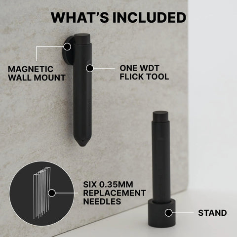 Subminimal Flick WDT espresso distribution tool mounted on a magnetic wall mount; black finish, six 0.35mm replacement needles and stand