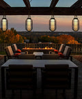 Big Solar Powered Lantern for Outdoor Use Heavy Duty Metal Hanging Lights illuminating a patio during sunset.