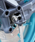 Portable Universal Motorcycle Wheel Lift Stand for Easy Tire and Chain Maintenance and Cleaning installed on rear wheel