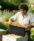 Man using Two Pack Six Point Five L Beehive Feeder With Beeswax Treated Wood Frames in garden