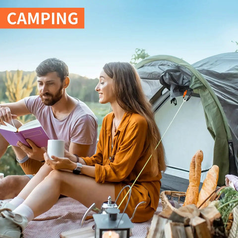 Couple near a tent with camping gear, ideal for using Beefy Heavy Duty Locking Carabiner Clips 12kN Aluminum 7075 Lightweight
