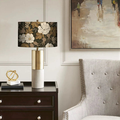 Table lamp with shade featuring fresh black and brown vintage floral peel and stick wallpaper in a cozy room setting.