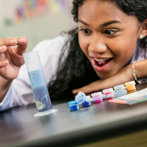 Color Chemistry Lab Kit For Kids Kid Friendly Safe Mess Free Experiments Build Color Mixing Skills Hands On STEM Activity Set For Young Scientists Fun Home Learning Project That Sparks Creativity And Curiosity. Child using clear plastic test tube with blue liquid