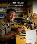 Worker using D5 Laser Engraver Air Purifier For P1 5W Mini Smoke Purifier next to laser cutting setup