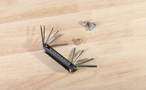 Tamper-Proof Folding Star Key Set 10 Pieces T-6 To T-30 with bolts on wooden table