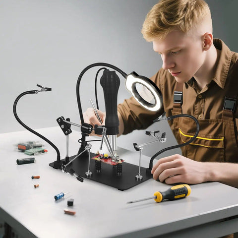 Person using Go-To Hands-Free Soldering Station With Upgraded 5x Magnifying Lamp, 360 Degree Clamp, Four PCB Holders, Extra Large Base