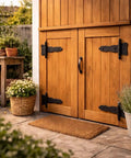 Pack Of 2 5 Inch Black Wrought Iron Shed Door Hinges Antique Style Flush Mount Cast Iron Barn Door Hardware visible on wooden shed