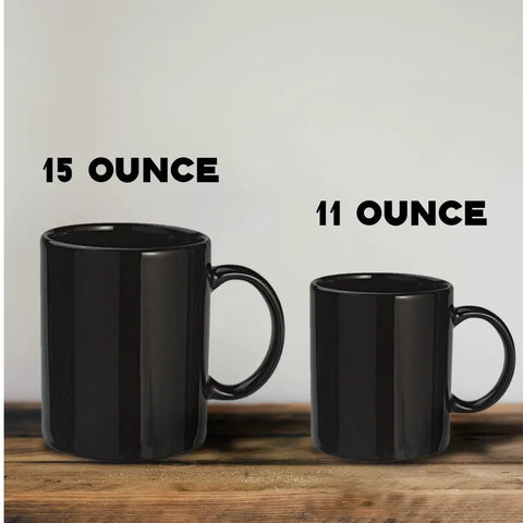 15 Oz black ceramic mug next to 11 Oz black ceramic mug, showcasing size difference for Sweet Retirement Ride Golf Cart Coffee Mug In 15 Oz Black Ceramic With Hella Durable Glaze For Retired Golfers And Youth Coaches Looking To Kick Back With Their Daily Brew.