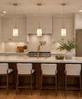 Karjearl Alabaster Pendant Lights Kitchen Island, Modern Gold Hanging Light above a white marble kitchen island.