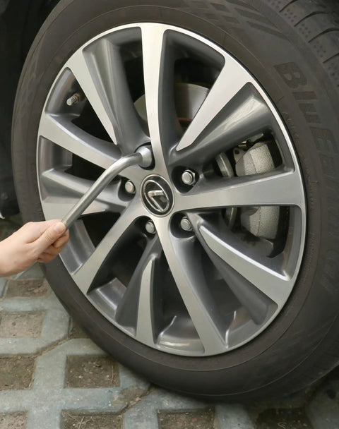 Rugged Tough As Nails Heavy Duty Tire Lug Wrench For Car Jack With Dual Head L Shaped Socket Tool in use on a car wheel.