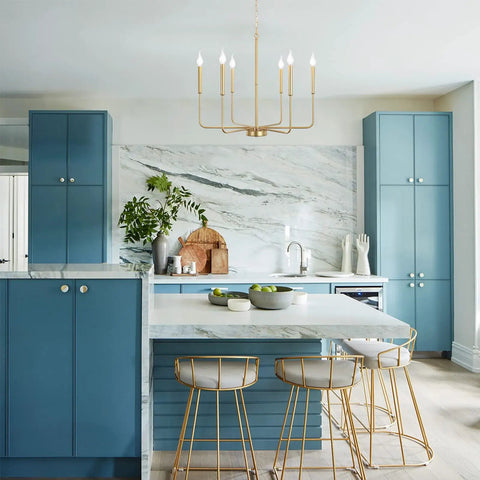 Gold Spray 6 Light Modern Farmhouse Candle Chandelier over kitchen island with blue cabinets