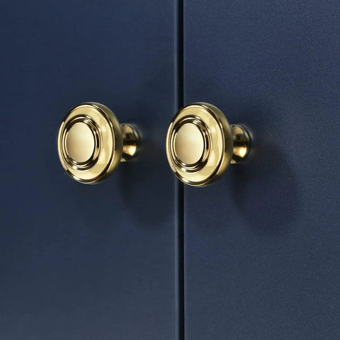Pair of gold drawer pulls installed on dark cabinet, part of five pack slick polished brass cabinet knobs 1.23 inch round