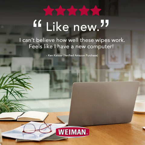 Front view: Weiman electronic screen cleaner wipes logo on desk beside laptop and glasses