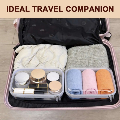 Two Pack Clear Hard Shell Zipper Case Travel Organizer Pouch with toiletries and rolled towels in suitcase.