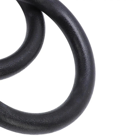 Close-up of black gymnastic ring from Gymnastic Rings With Straps Heavy Duty Up To Six Hundred Sixty One Lb Load Bearing Workout Equipment