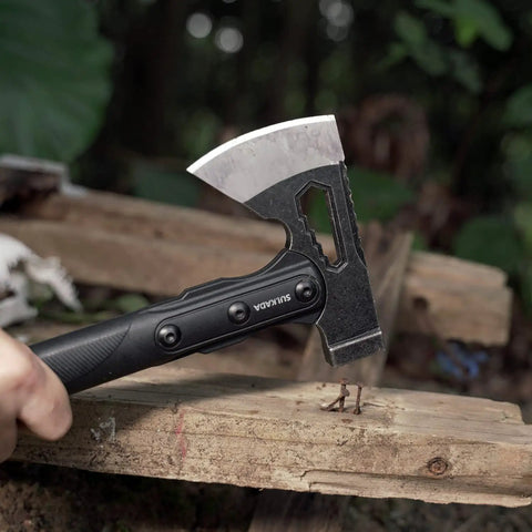 Close-up of Camping Hatchet For Real Wood Chopping And Outdoor Survival with stainless steel blade and anti-slip grip in use.