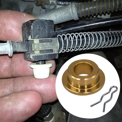 Throttle valve TV cable linkage with brass grommet bushing and two retaining pins, close-up view