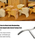 Curved lathe tool rest with 1-inch post; chrome finish shown beside wooden toy animal figures.