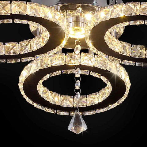Close-up of LED Crystal Pendant Ceiling Light With 3 Rings Cool Sleek Chandelier Flush Mount with glowing K9 crystals
