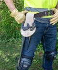 Person wearing Leather Riveted Spud Wrench Holder With Tunnel Connection For Dual Spud Wrenches And Adjustable Head Construction Wrench