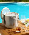 Keep It Frosty 4.8 Liter Insulated Ice Bucket With Snug Fit Lid And Drop Handle Scoop next to drinks by poolside.