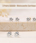 Hypoallergenic Titanium Screw Back Earrings Set Three Pairs VVS1 Sparkling Moissanite Studs on display.