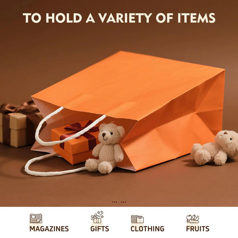 Orange kraft gift bag with handles holding plush toys and a gift box; Kraft Gift Bags With Handles Bulk Pack 24 Small Party Favor Bags