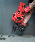 Person using Auto Feed Drain Auger 120V 23 Foot Drain Snake For Three Quarter To Two Inch Pipes Unclogs Sinks Showers Floor Drains