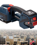 Heavy Duty Handheld Automatic Strapping Machine For One Half To Five Eighth Inch Pp Pet Straps With Built In Battery Powered Electric Banding Tool.
