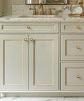 Antique Brass Cabinet Knobs 1-1/4 Inch Round Drawer Handles on gray cabinet for vintage kitchen decor.