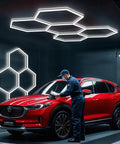 Hexagon LED Honeycomb Garage Light System 192W 23040LM Ultra Bright 6500K White Ceiling Lights illuminating a garage with a car.