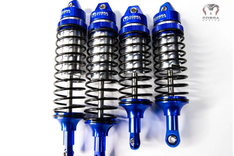 Blue Aluminum BigBore Shocks For 4x4 And 2WD Trucks And SUVs Front And Rear Adjustable Suspension Shown In Set Of Four