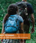 Two hikers with backpacks, 5 In 1 Tactical Spork for Outdoor Adventure Stainless Steel Spoon Fork Knife clipped on pack